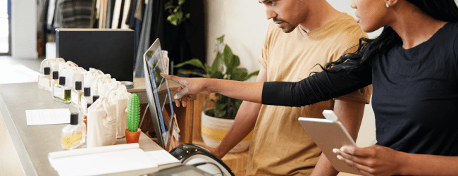 Man and Woman looking at a computer screen