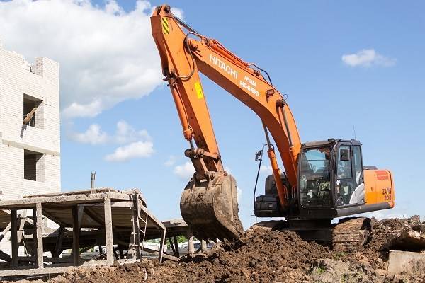 Excavator machine digging out soil