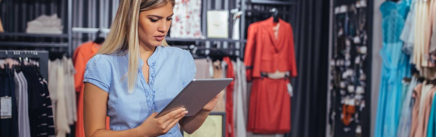 woman in retail setting using tablet