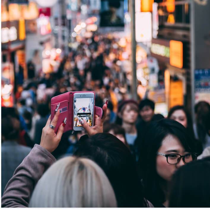 Woman phone busy street