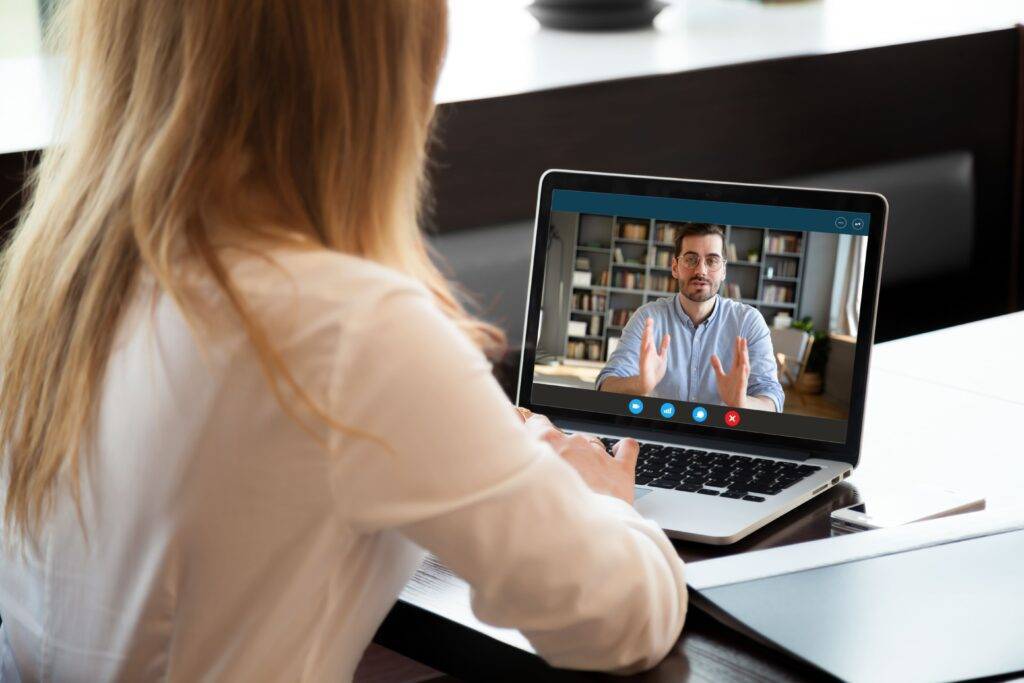 woman having meeting on laptop