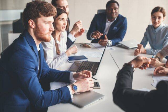 Group of people around a table during meeting