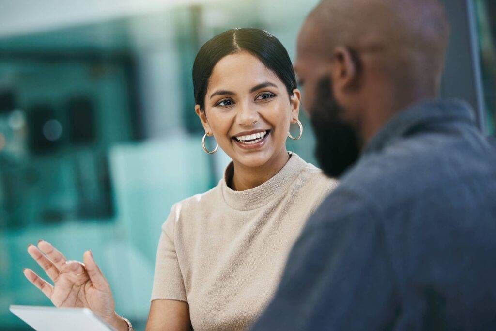 Shot of a businesswoman having a meeting with her colleague while using a digital tablet.