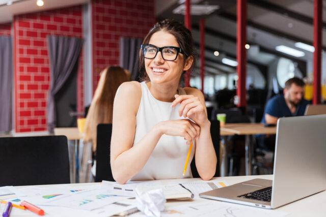 woman smiling in workplace setting