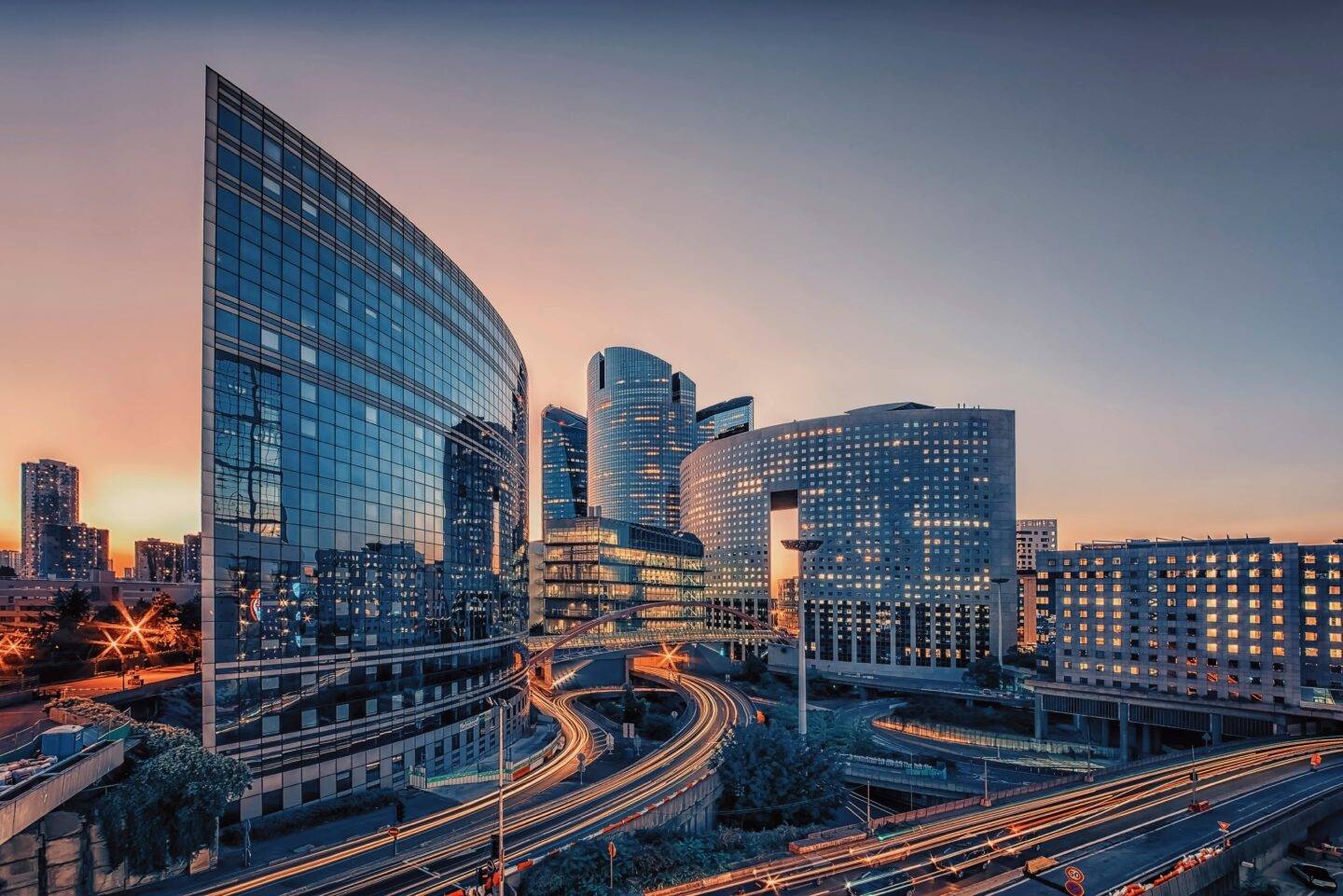 An urban scape with modern office buildings and motorways