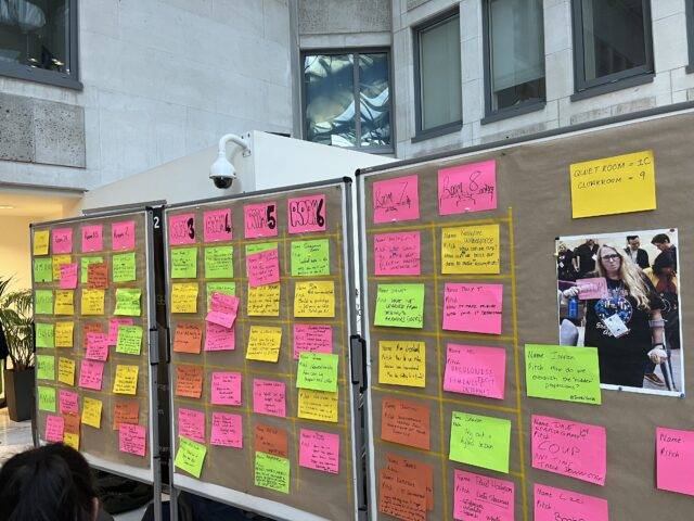 Board covered in coloured sticky notes at uk gov camp