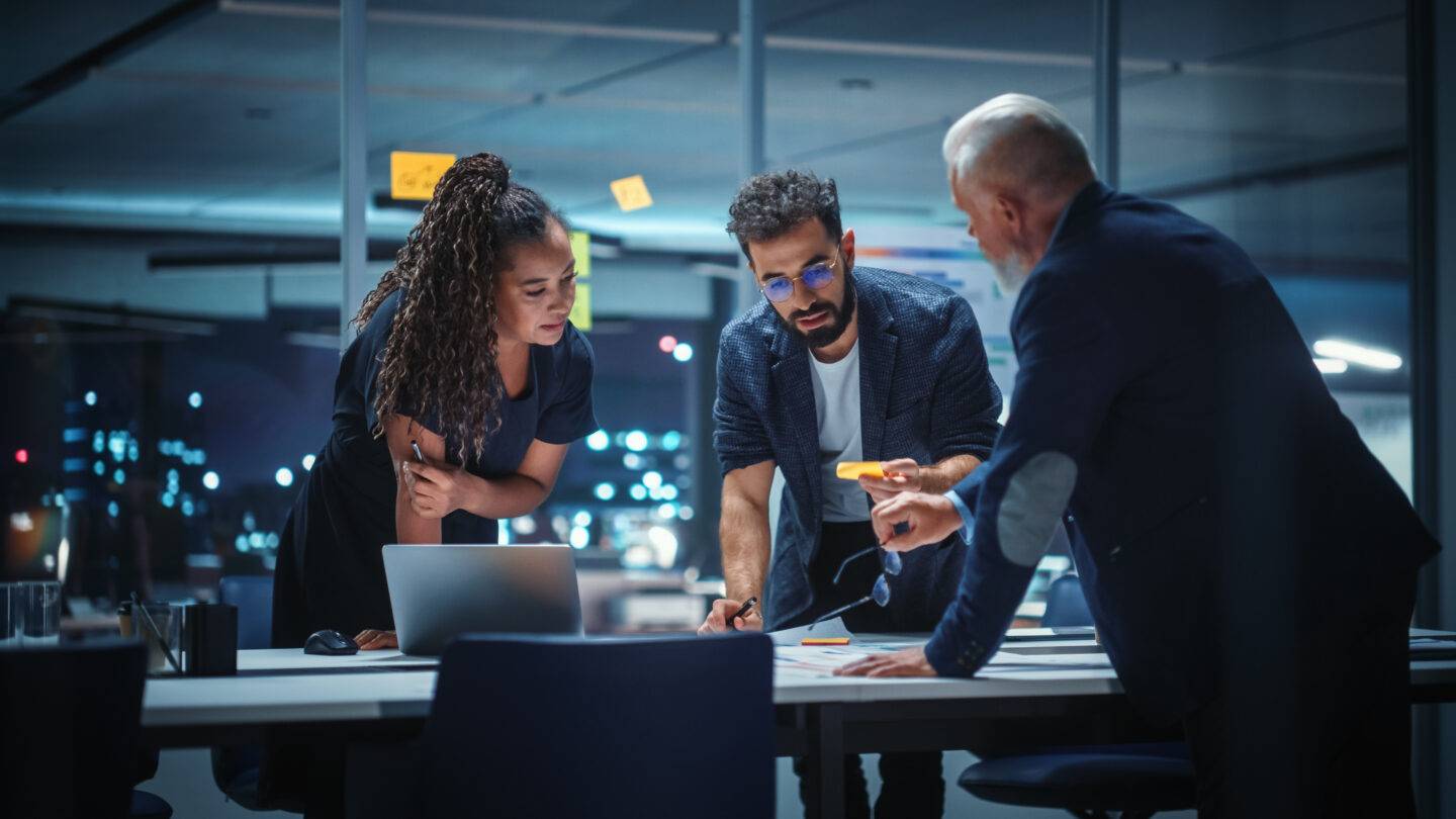 Office Conference Room Meeting: Diverse Team of Top Managers Talk; Brainstorm; Use Digital Tablet. Business Partners Discuss Financial Reports; Plan Investment Strategy. Team of Three